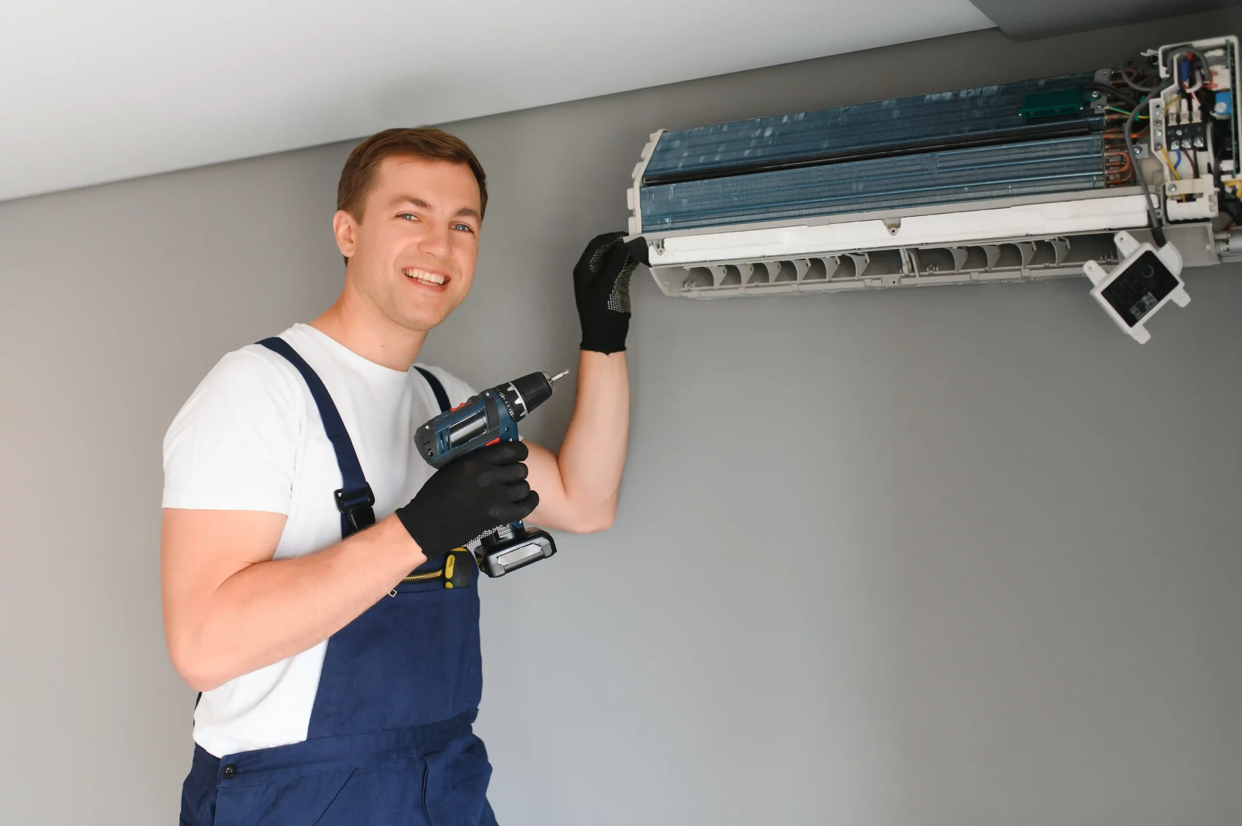 technician service checking and repairing air conditioner indoors photo